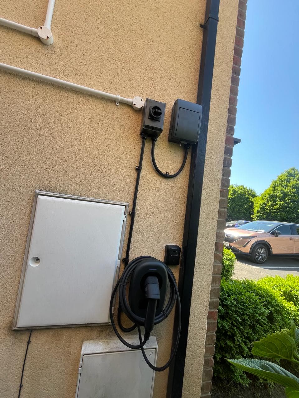 EV charger with isolator and meter side view