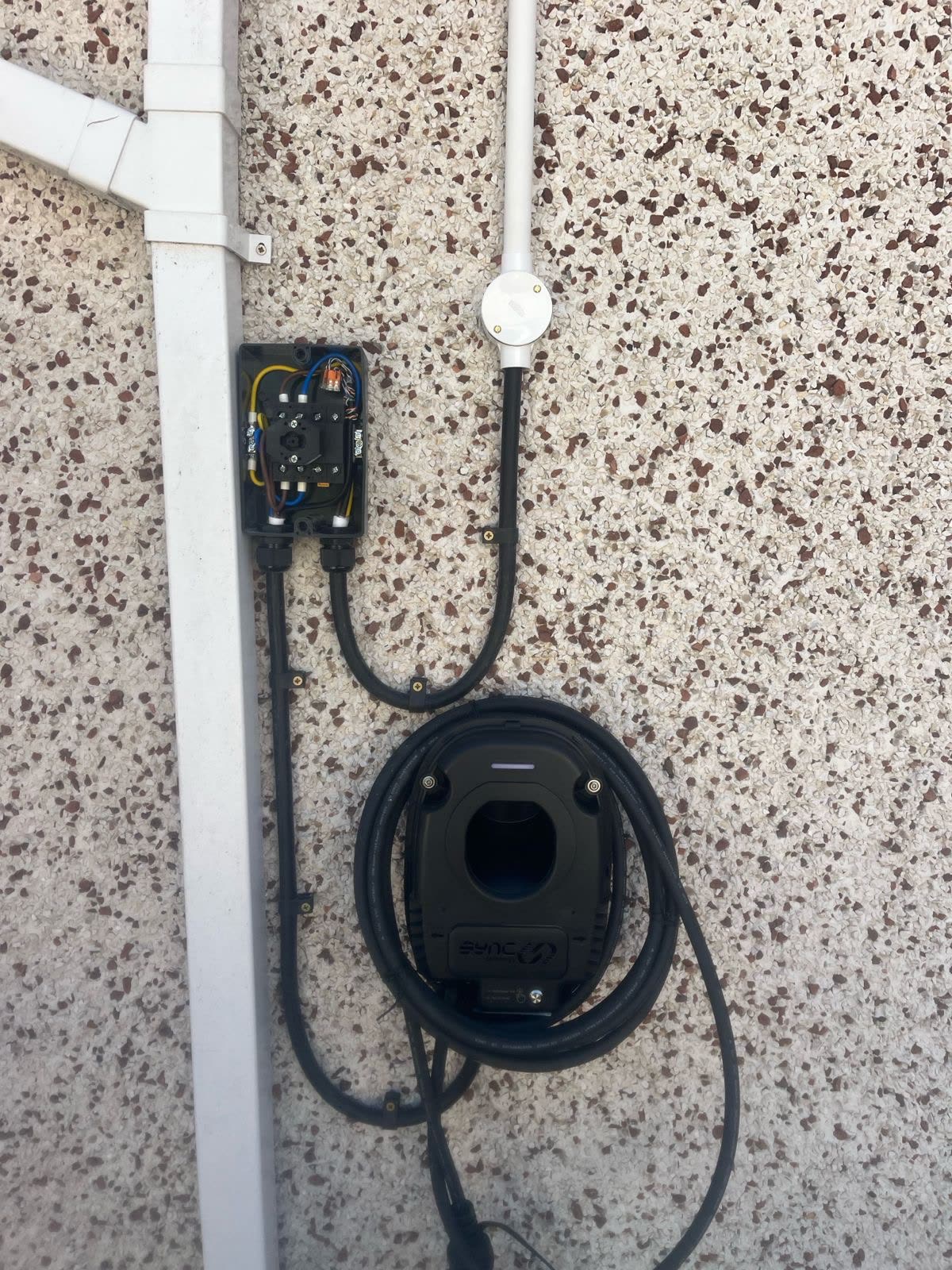 Sync EV charger with rotary isolator and conduit