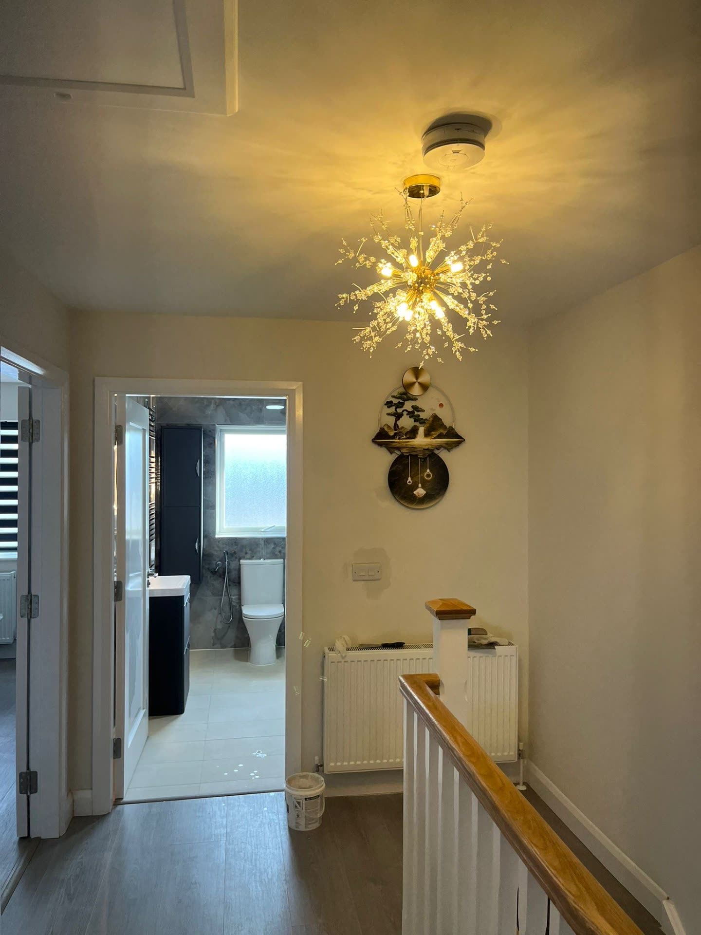 Landing chandelier installation